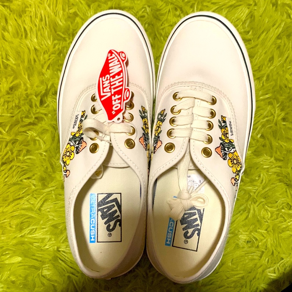 White women’s vans. Mushroom and flower detailing. Never worn